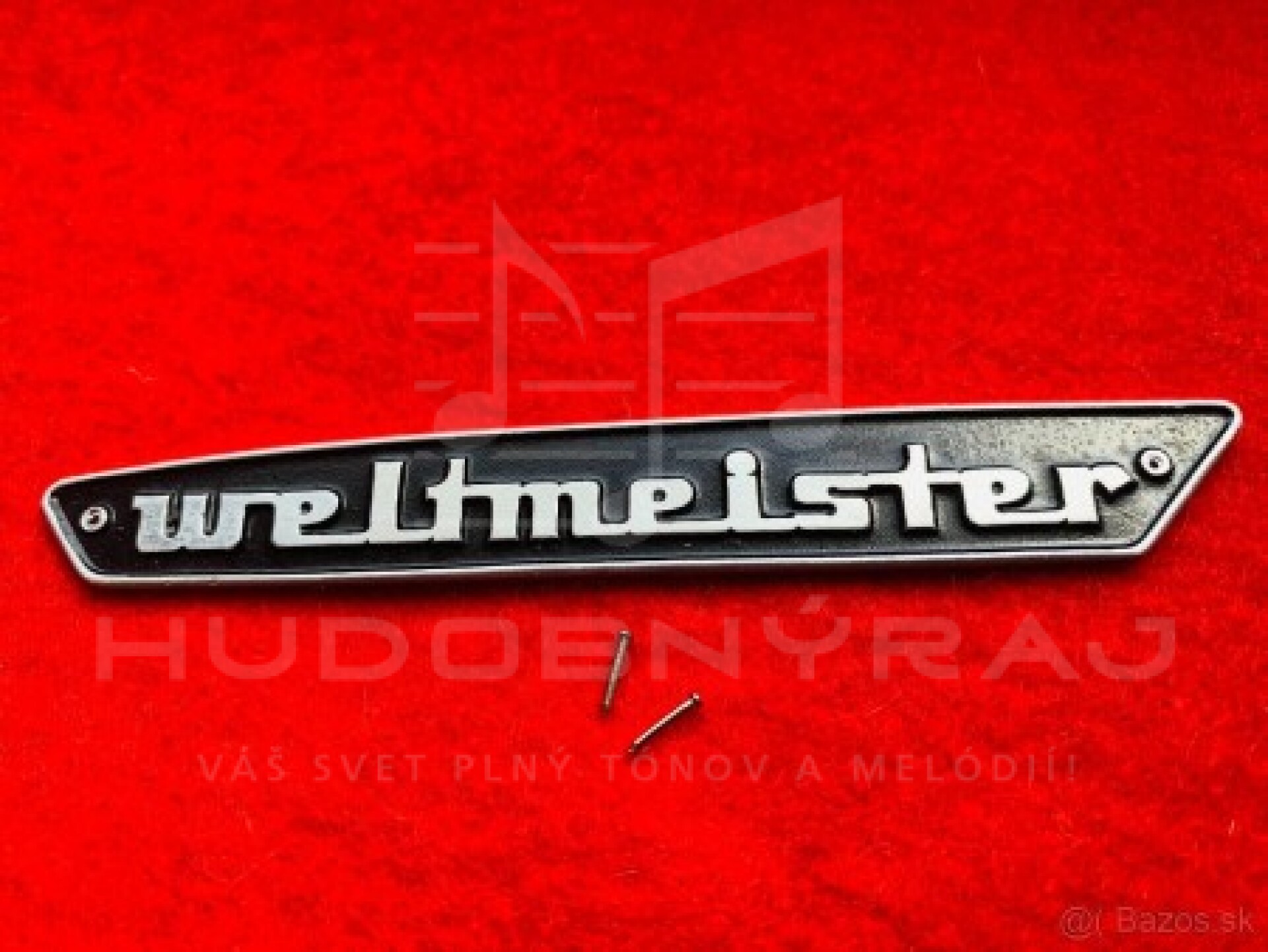 Logo Weltmeister na Akordeón+ 2 ks klinčeky- materiál- hliniková doštička